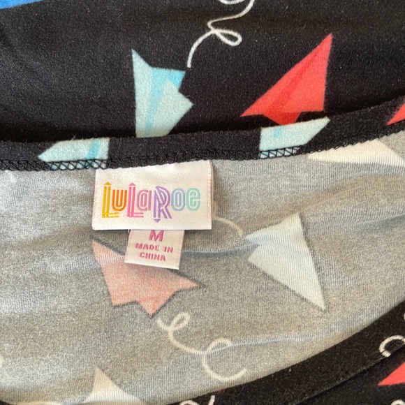 LuLaRoe Americana Irma Tunic: Black with Red, White and Blue Paper Airplanes (M) - Picture 3 of 4